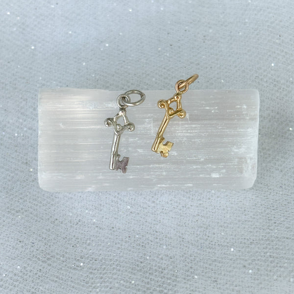 Myth and Stone Orfira's Key charms in silver and gold