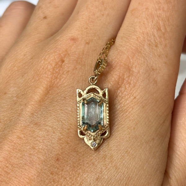 Myth and Stone Temple of Hope green beryl pendant on hand