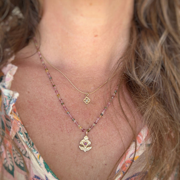Myth and Stone Ostara ruby flower pendant with hand knotted tourmaline necklace