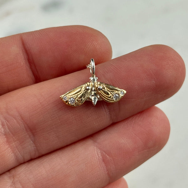 Myth and Stone Metaphora Moth necklace on hand