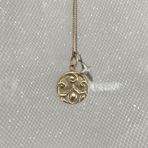 Myth and Stone Lotus medallion in 14k with silver North Star charm