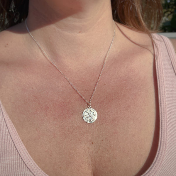 Myth and Stone Mythic medallion on neck