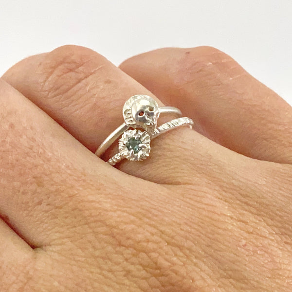 Myth and Stone Sapphire Illuminated Flower ring stacked on finger