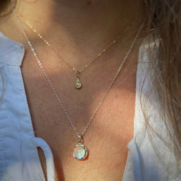 Myth and Stone Inner Light opal pendant on model