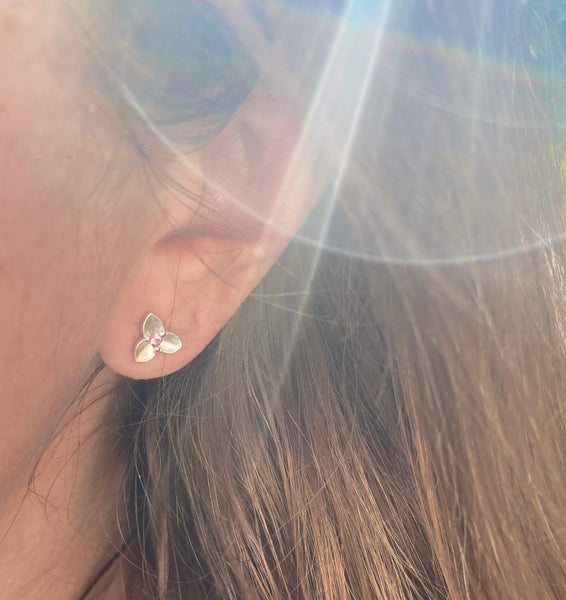 Myth and Stone Trillium studs in silver with spinel on model