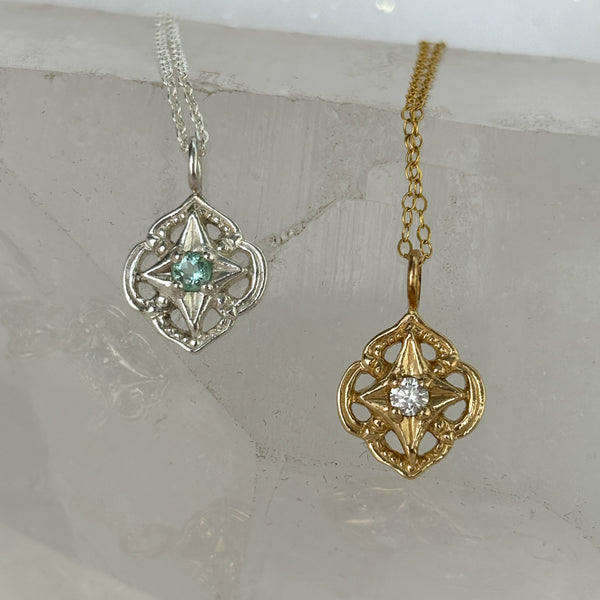 Myth and Stone Compass of Light pendants in silver and gold