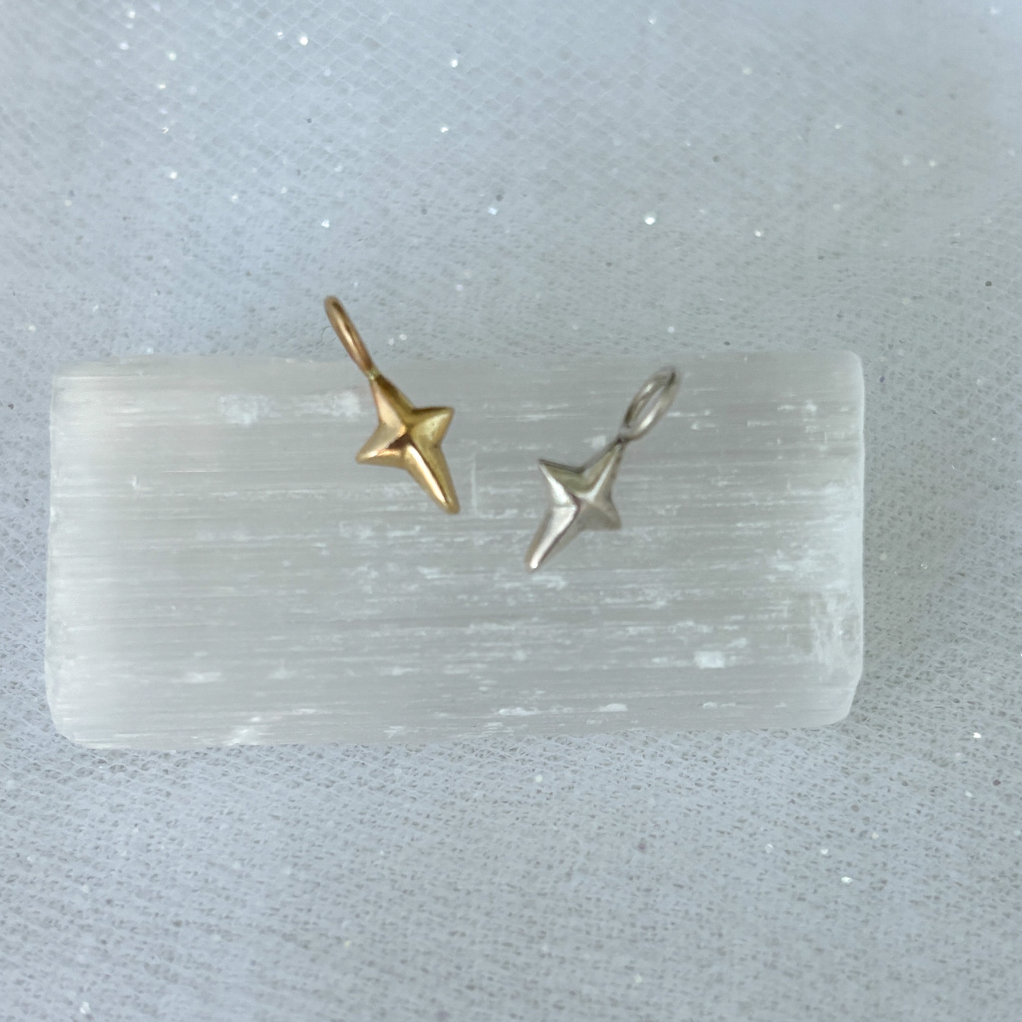 Myth and Stone North Star charms in silver and gold