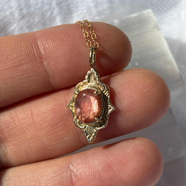 Myth and Stone Mystic Mirror sunstone pendant in the sun