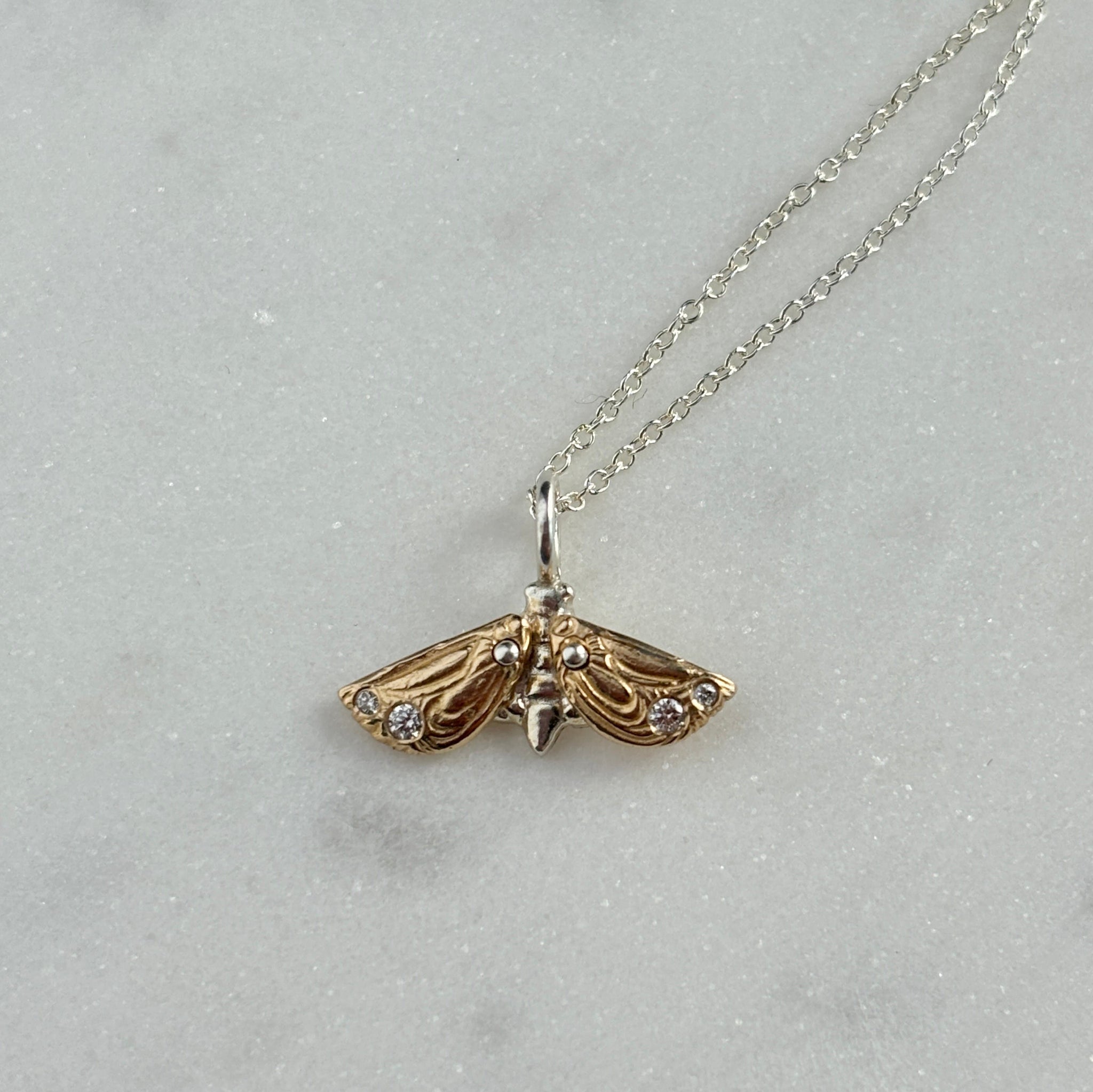 Myth and Stone Metaphora Moth necklace in silver and gold