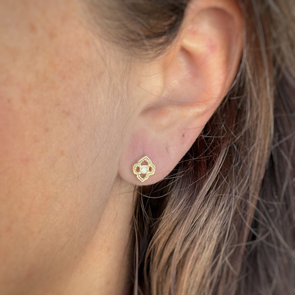 Myth and Stone Arabesque studs in gold on ear