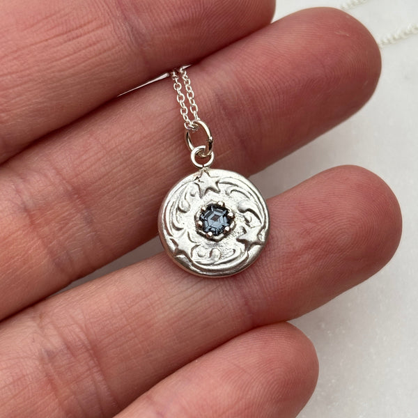 Myth and Stone Stars Align pendant in silver on hand