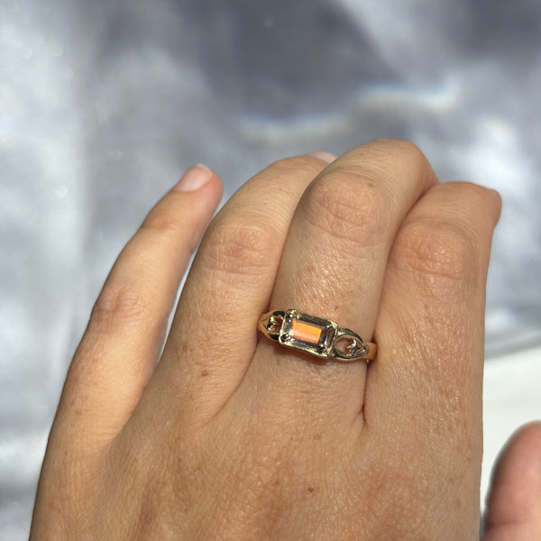 Myth and Stone Selene moonstone ring showing peach flash on hand