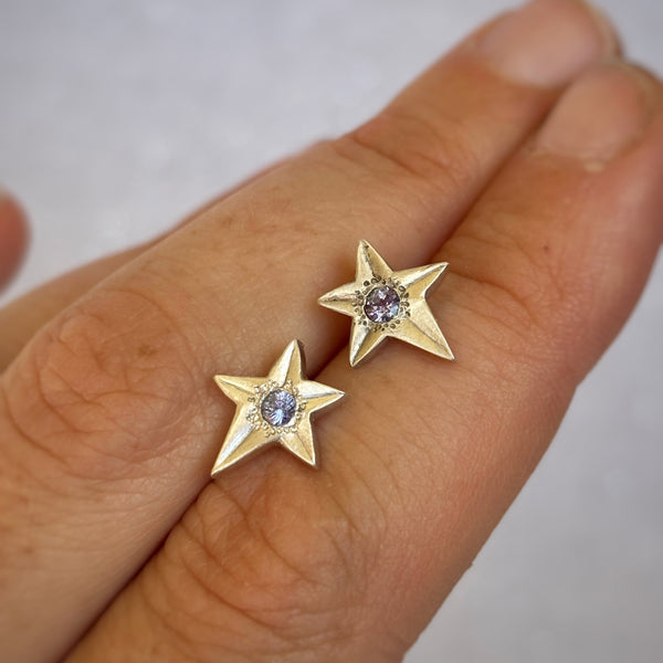 Myth and Stone Stardust tanzanite studs on hand