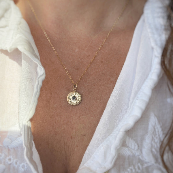 Myth and Stone Stars Align gold pendant on model