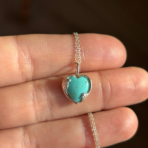 Myth and Stone Peaceful Heart turquoise pendant in hand