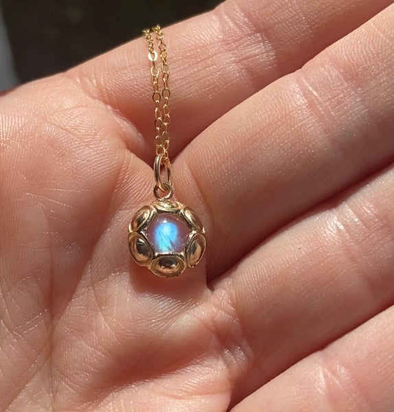 Myth and Stone Moon Portal necklace in 14k in hand