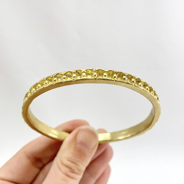 Myth and Stone Polymnia bangle bracelet in brass front view