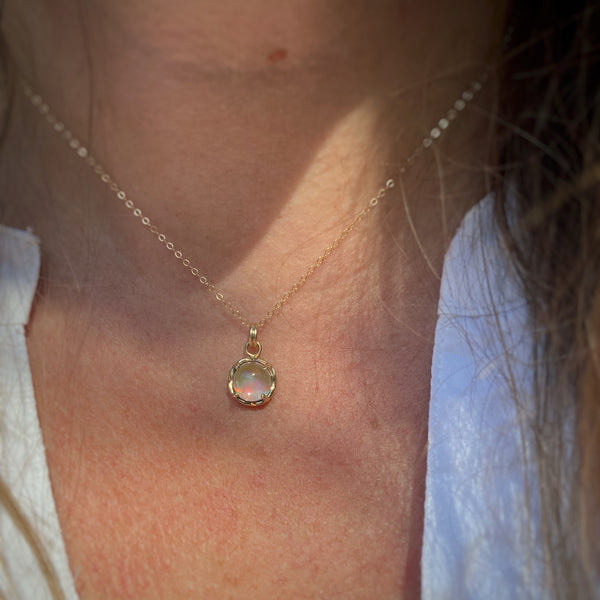 Myth and Stone Inner Light opal pendant in gold on model