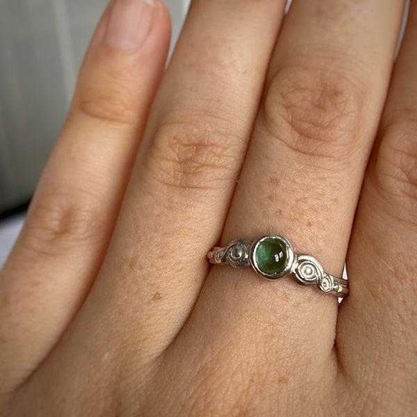 Myth and Stone Curiosity ring in silver and green on finger