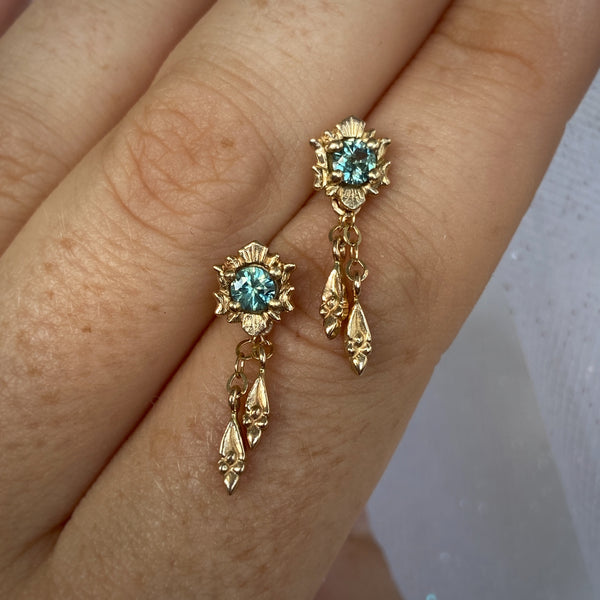 Myth and Stone Fortuna Drop earrings in gold and sapphire on hand