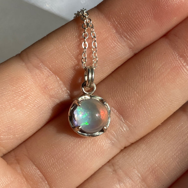 Myth and Stone Inner Light opal pendant in hand
